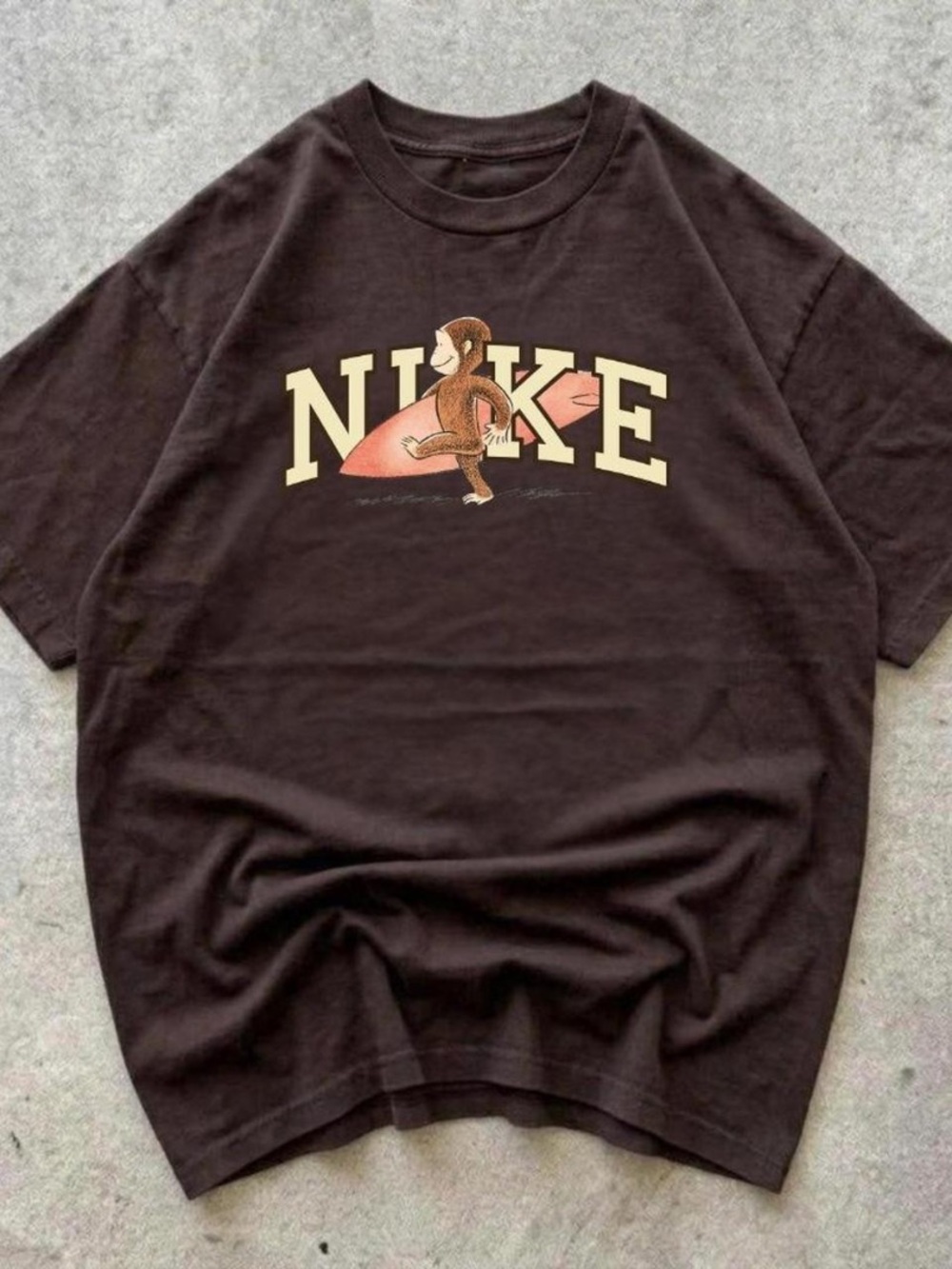 Nike Women’s Brown Graphic Tee with Surfing Monkey
